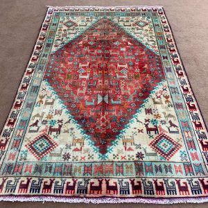 Vintage Afghan Handmade Wool Rug showing full view in beige and multi-color pattern.