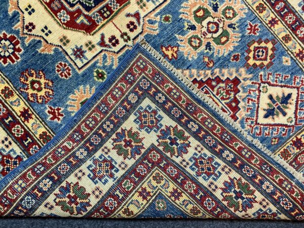 Beige and Green Afghan Handmade Wool Area Rug showcasing floral pattern