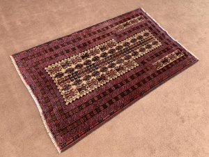 Close-up of the intricate yellow, blue, and red patterns on a 3.10x6.8 Ft Afghan Pictorial Vintage Rug.